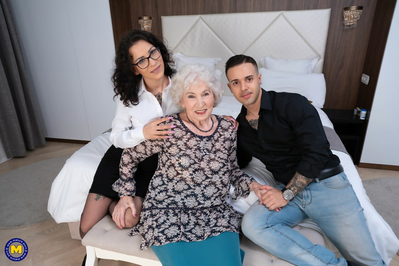 Kinky granny takes part in a threesome with a younger couple