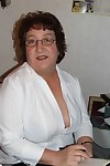 Granny Kinky Carol reveals her huge tits and phat ass in black lingerie