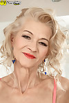 Old lady Beata slips off skirt and peach panties wearing tan colored stockings