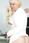 Naughty granny in nurse uniform stretching her twat by her fingers