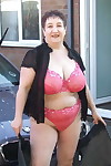 Fat old lady Kinky Carol bares her big tits while soaping up during a car wash