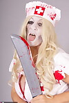 Old blonde amateur Savana removes a nurse uniform during a cosplay scene