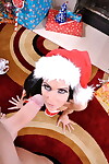 Busty Jessica Jaymes toys her ass while sucking dick in front of Xmas tree