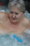 Old woman Valgasmic Exposed plays with her breasts while hot tubbing