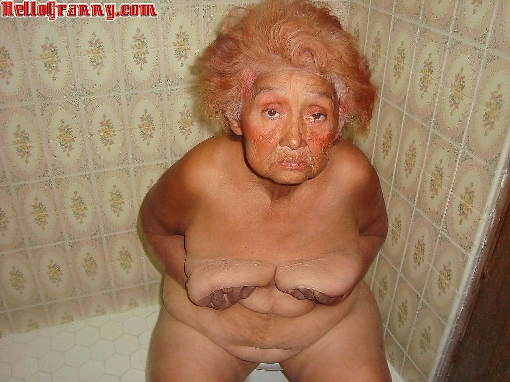 Painted granny in the shower plays with her boobs - part 3891