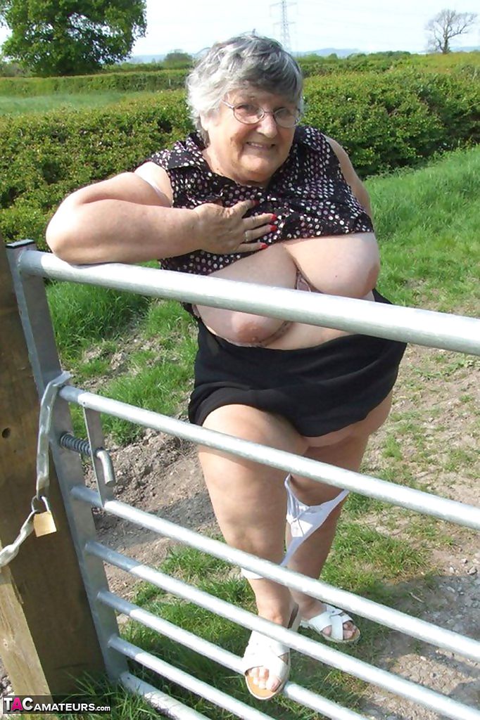 Horny granny Grandma Libby exposes massive big tits and huge ass at the farm
