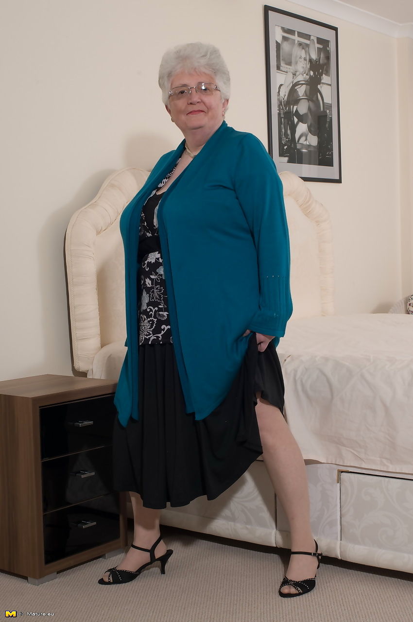 Overweight British grandmother covers her naked boobs with her hands
