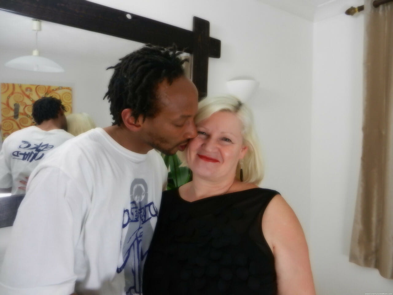 Horny granny Lacey Starr seduces a skinny black stud and fucks his huge rod