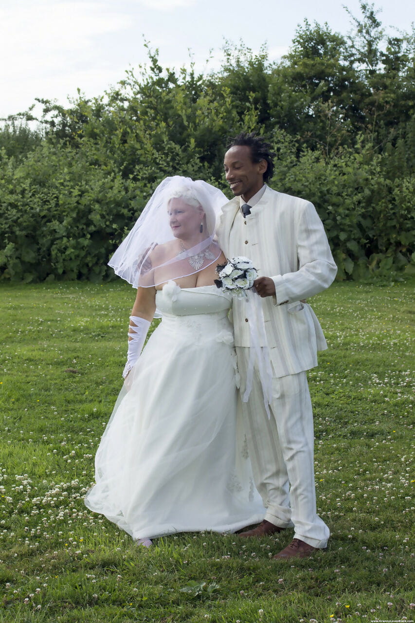 Mature bride Lacey Starr blows off her black groom after the wedding ceremony