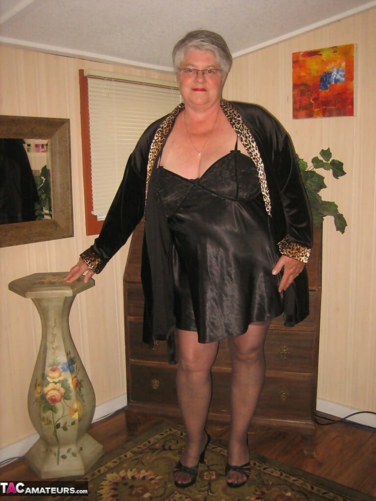 Fat old woman Girdle Goddess doffs black lingerie to pose nude in stockings