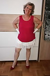 Horny nan Caro pulls down her pantyhose to show her bush in white gloves
