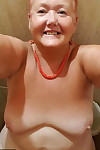 Fat granny with red hair Valgasmic Exposed takes naked selfies at home