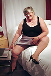 Obese granny Grandma Libby creams her vagina after getting naked on her bed
