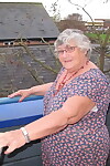 Fat UK nan Grandma Libby bares her tits on a balcony before getting butt naked