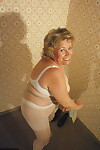 Old woman Caro shows her big natural tits in white pantyhose
